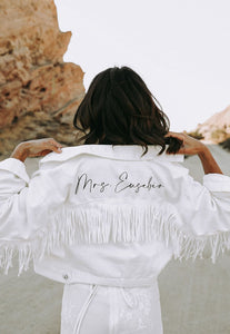 White fringe bride jacket with future last name on the back 