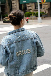 custom blue pearl denim bride jacket with pearl and rhinestone patches saying bride on the back
