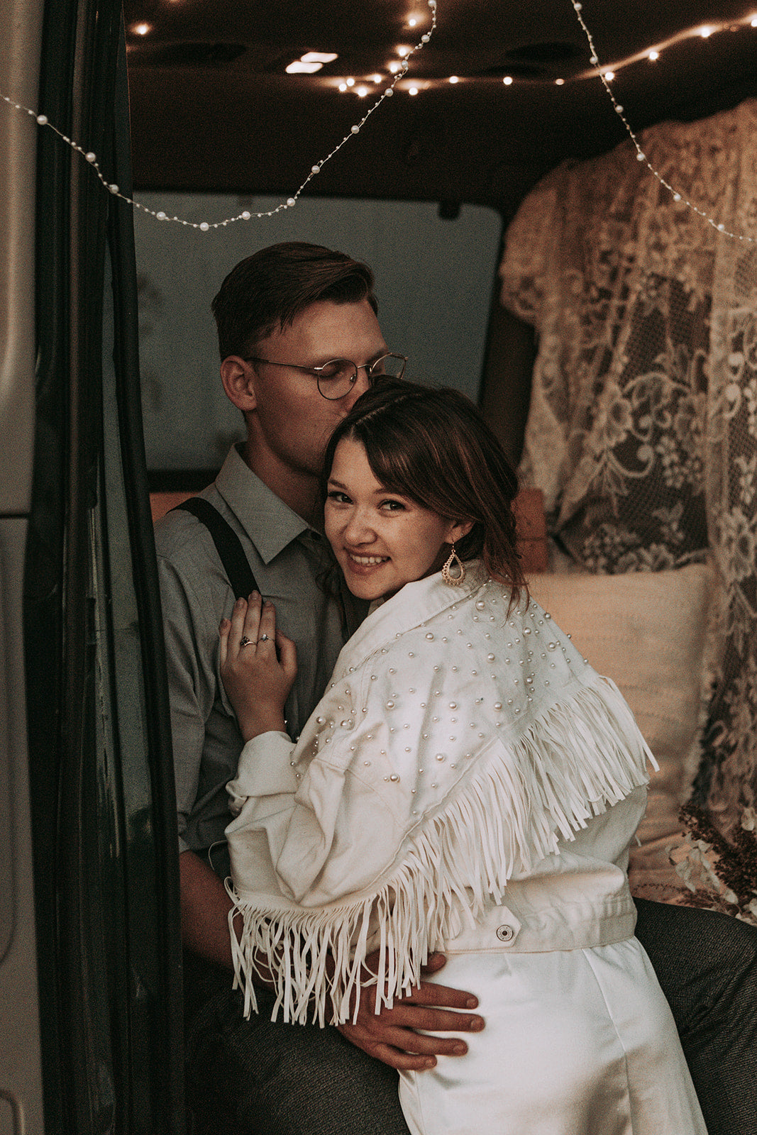 White cropped denim bride jacket with pearls and fringe.