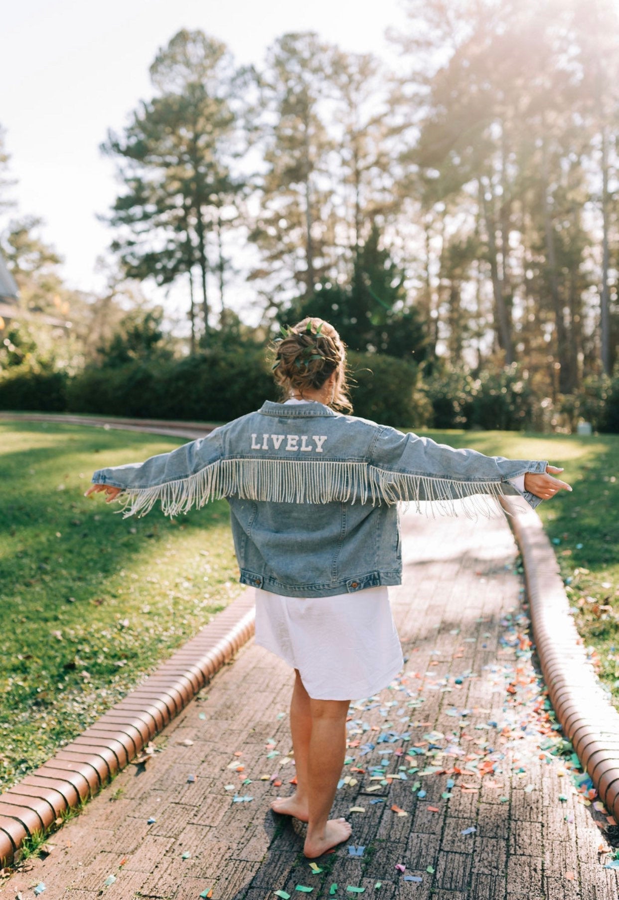 Rhinestone fringe jacket on bride on the wedding day.