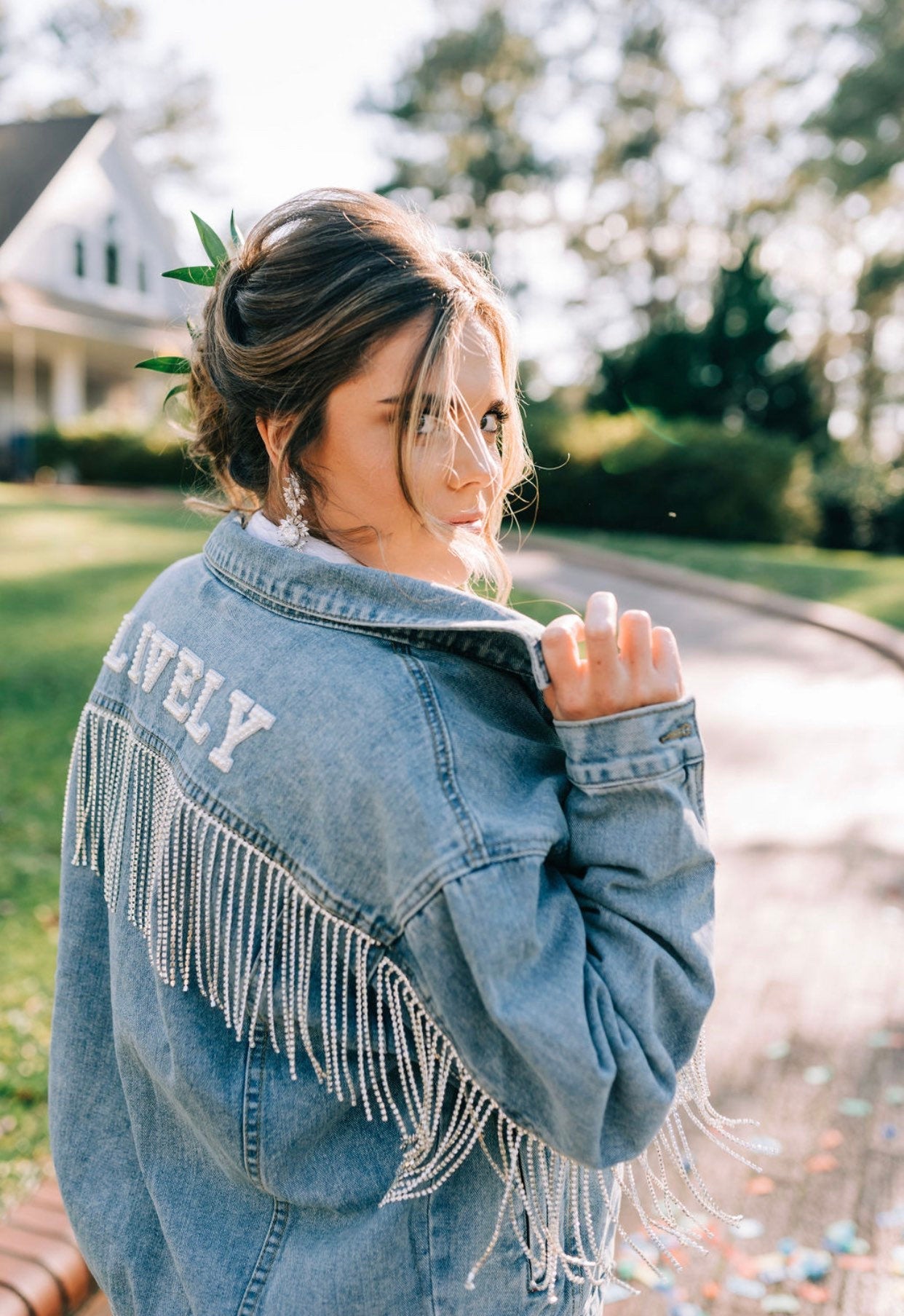 Blue denim with rhinestone fringe and future last name.